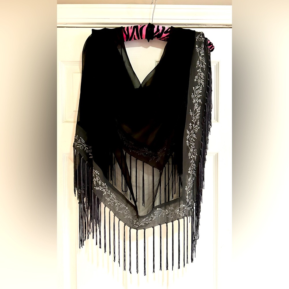 Beautiful sheer wrap with fridge and embroidered detail!